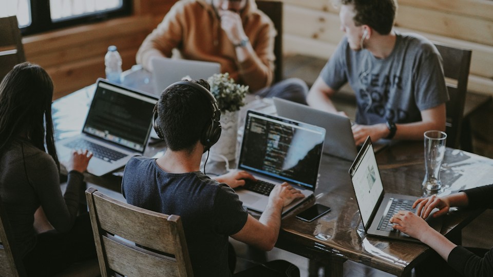 A startup team working together around a table